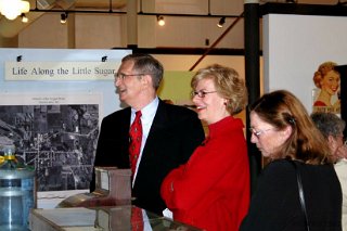 Roger Dooley explains our new pharmacy display to U.S. Rep. Tammy Baldwin (red) and her aide.